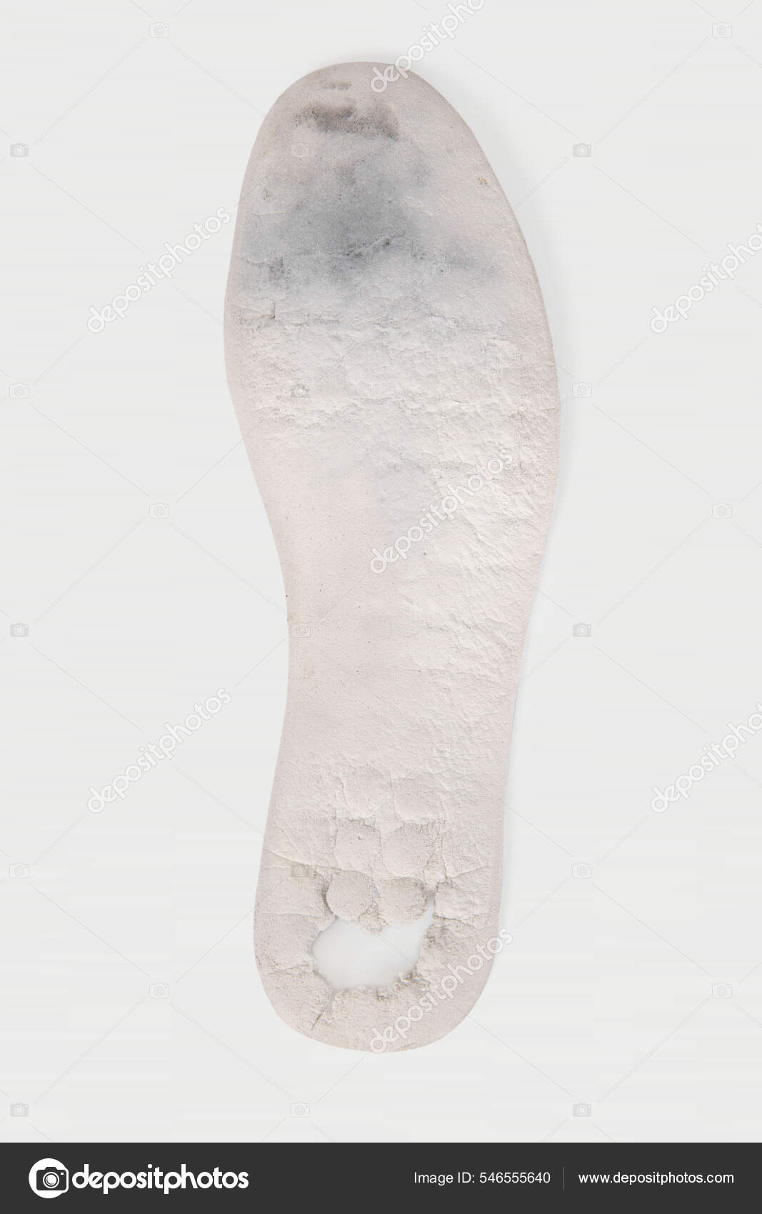 Old and shabby orthopedic insoles isolated on white background