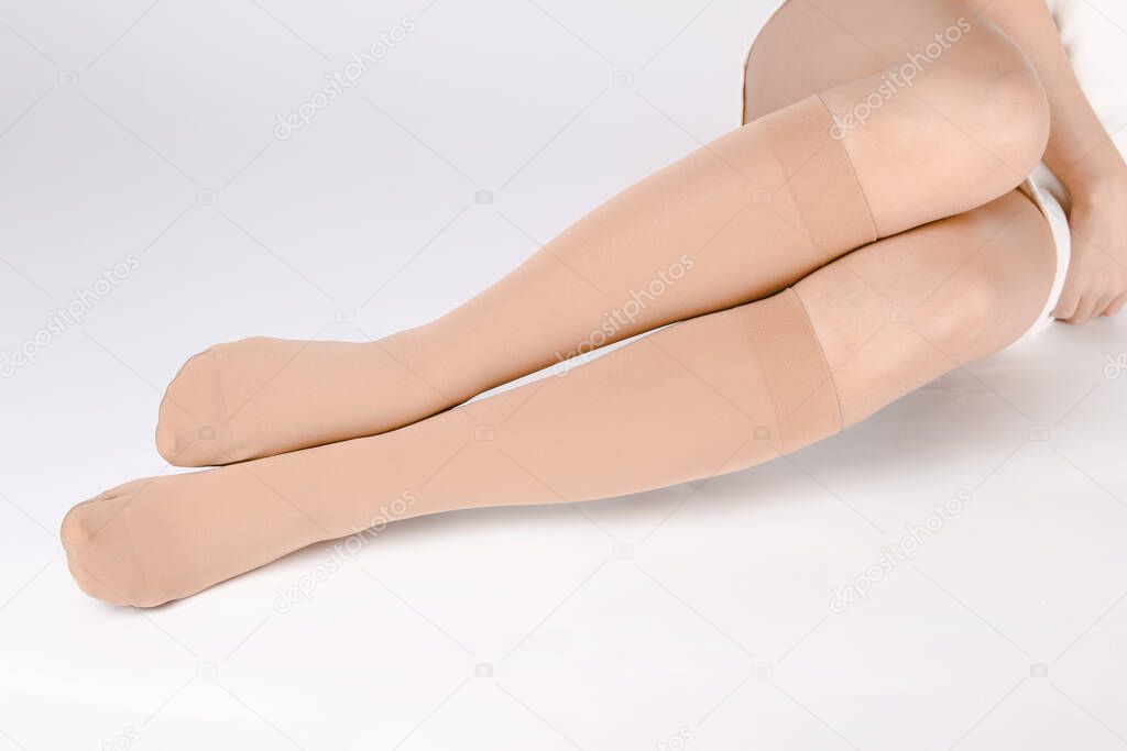 Medical Compression Stockings for varicose veins and venouse therapy. Compression Hosiery. Sock for sports isolated on white background. Black color socks mock up for advertising, branding, design