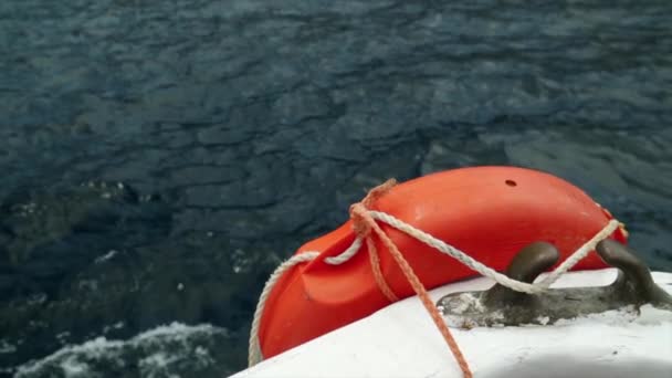 Orange Lifebuoy Boat Foreground Beautiful Deep Blue See Background Slowmotion — Stock Video