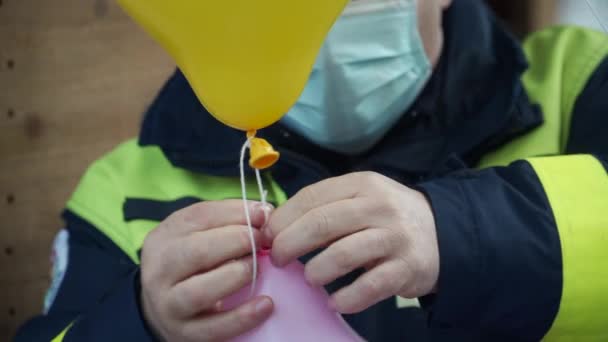 Tying Two Balloon String Flying Away — Stock Video