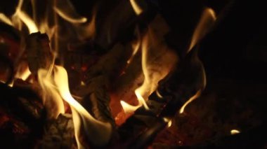 extreme close up of some wood burning in a fireplace in slowmotion