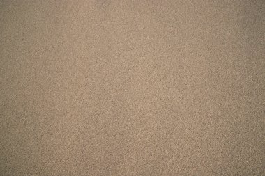Kum dokusu arka planı. Kum desenli plaj