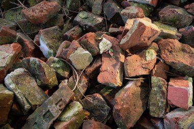 Old bricks scattered in the courtyard Textured background