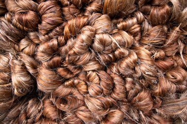 Thick Golden bundle of Wet raw jute fiber Texture Background