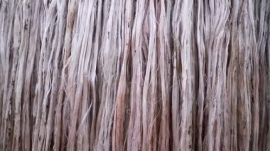 Close-up shot Hanging Raw jute fiber swings in the air
