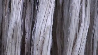 Close-up shot Hanging Raw jute fiber swings in the air