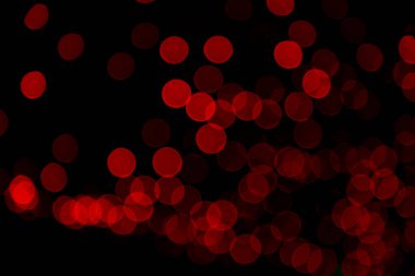 Kırmızı Defocus soyut bokeh ışık efektleri gece siyah arkaplan dokusu üzerinde