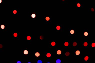 Kırmızı Defocus soyut bokeh ışık efektleri gece siyah arkaplan dokusu üzerinde