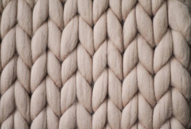 Açık gri örgü arka plan. Örgü desenli yün kumaş. Çizimin tarafsız arkaplanı.