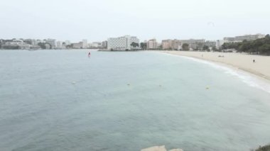 Kitesurfing And Windsurfing At The Scenic Beach In Mallorca, Spain. - aerial