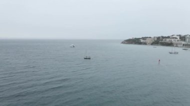 Sailboat Moving By The Waves At Palma Bay With Foggy Horizon In Majorca Island, Spain. - aerial