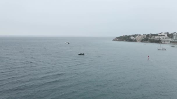 Sailboat Moving By The Waves At Palma Bay With Foggy Horizon In Majorca Island, Spain. - aerial — Vídeos de Stock