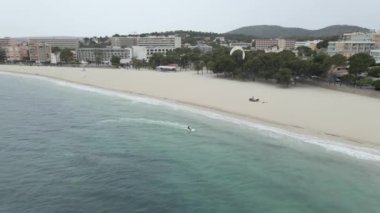 Speeding Kitesurfer In A White Wave In The Beach Of Mallorca, Spain - aerial drone shot