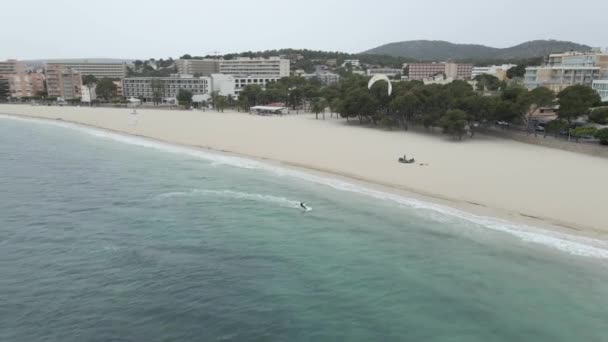 Speeding Kitesurfer In A White Wave In The Beach Of Mallorca, Spain - aerial drone shot — Stock video