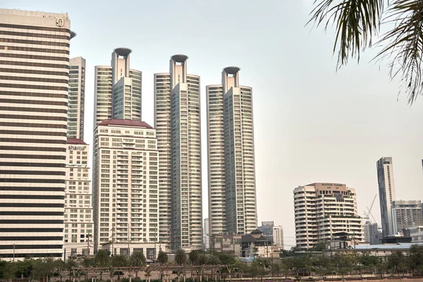 Urban landscape of a line of similar skyscrapers in Bangkok, Thailand