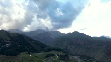 Stepantsminda (Kazbegi) and Gergeti. Aerial drone shot. 