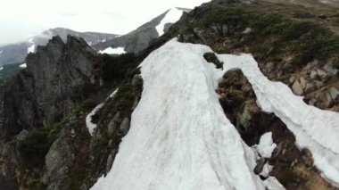 Drone flying between the rocks. Ukrainian Carpathian Mountains. Chornohora. Shpytsi.
