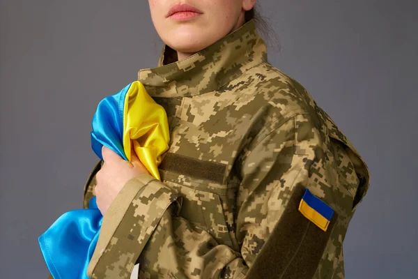 Ukrainian female in military uniform ready to defend her motherland. Armed Forces of Ukraine