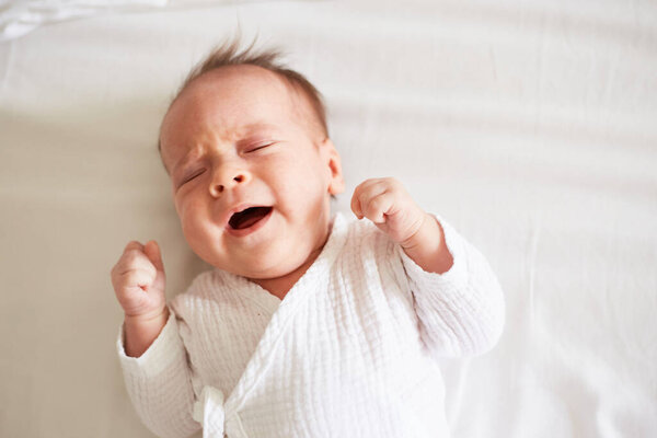 Crying Newborn one month old baby boy. Crying baby