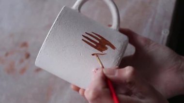 Female ceramist working in pottery studio. Ceramist's Hands Dirty Of Clay. Process of creating pottery. Master ceramist works in her studio. vertical video