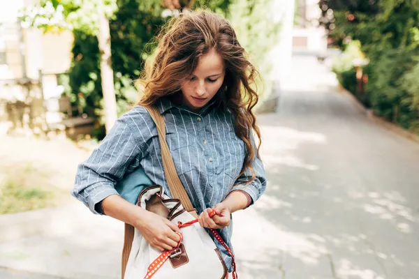Outdoor Shot Woman Red Long Hair Blue Jeans Shirt Searching Stock Picture