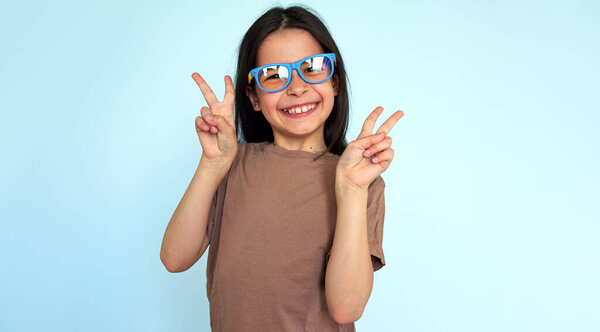 Happy Little Girl Colroful Eyeglasses Smiling Looking Camera Showing Peace Royalty Free Stock Images