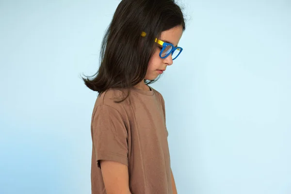 Side View Portrait Cute Little Girl Brown Shirt Blue Yellow Fotografias De Stock Royalty-Free