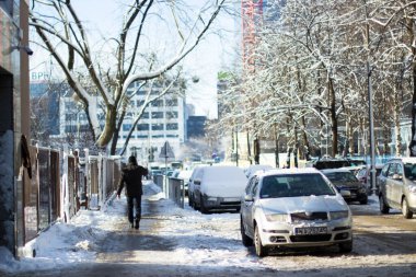 snow covered cars in warsaw, poland