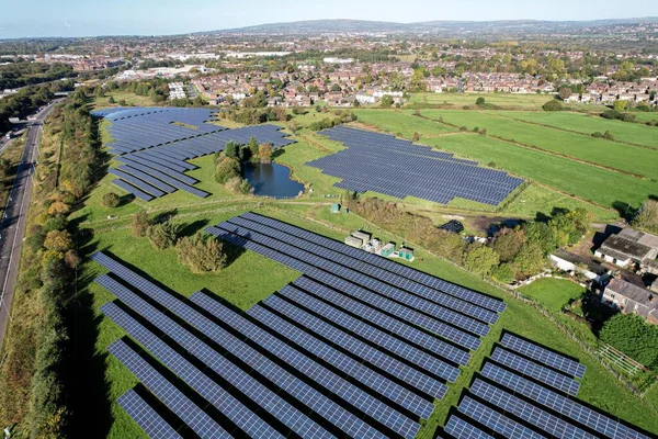 energy saving, global warming Solar energy farm. High angle, elevated view of solar panels energy farm rural England; full frame background texture