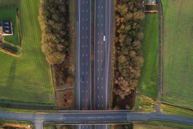 Morning sunrise highway motorway traffic. Aerial shot, top down view