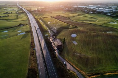 sunrise motorway highway countryside greenery british countryside aerial drone above view