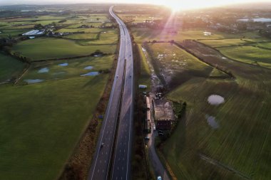 sunrise motorway highway countryside greenery british countryside aerial drone above view