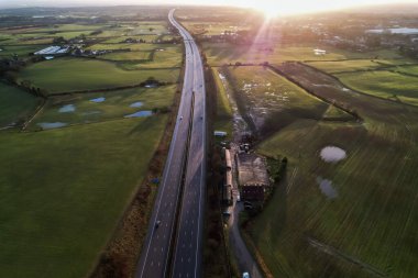 sunrise motorway highway countryside greenery british countryside aerial drone above view clipart