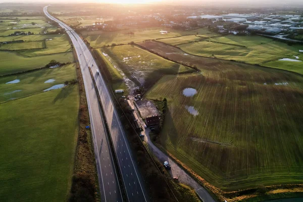 sunrise motorway highway countryside greenery british countryside aerial drone above view