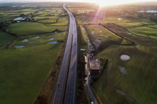 sunrise motorway highway countryside greenery british countryside aerial drone above view