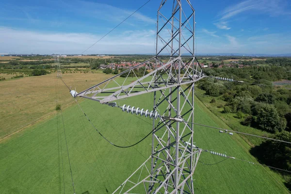 High voltage power line against a blue sky