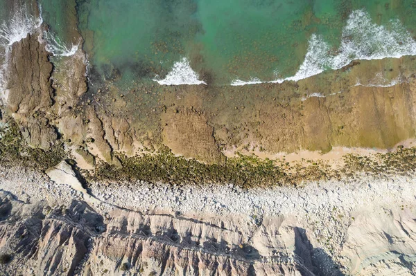 Beach and waves from top view. Turquoise water background from top view. Summer seascape from air. Top view from drone. Travel concept and idea