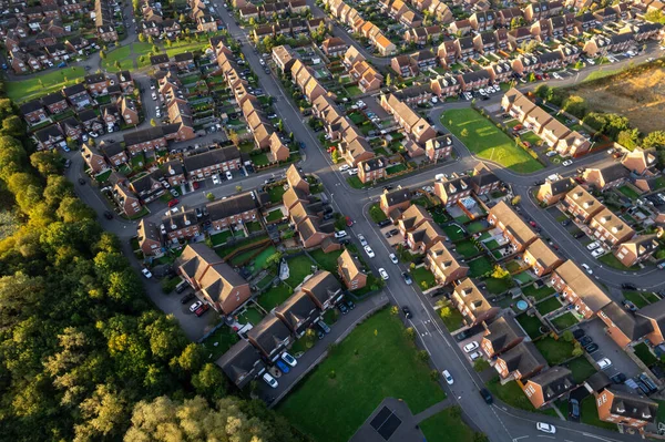 Top down aerial view of houses and streets in a residential area UK New Build Estate Agent House Prices 2022