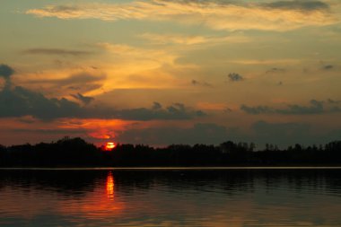 Colourfull sky during sunset over the Narew river 