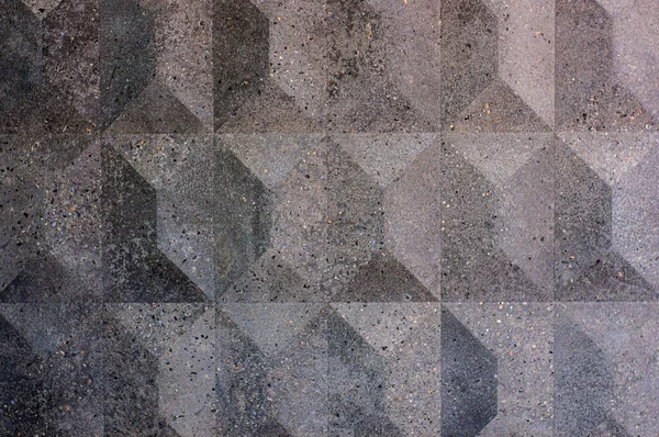 Texture of ceramic tiles with embossed rhombuses and pyramids, granular surface. Gray geometric volumetric background — Fotografia de Stock