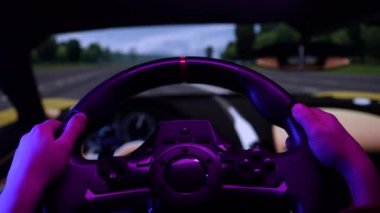 Little child driving simulator game on pc computer. Young boy using play station game with steering wheel. Kid playing car racing simulator on a video controller at home, learning to drive concept