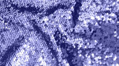 Yeni yıl elbisesi için pulların şenlikli menekşe dokusu. 2022 'de moda rengi çok iyiydi..