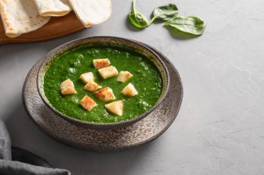 Palak Paneer served with basmati rice. Indian vegetarian cuisine. Copy space.