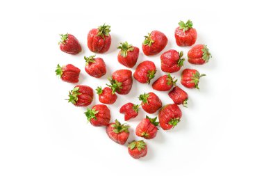 Ugly white ripe organic strawberry on white background.