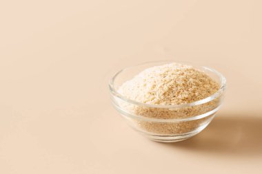 Psyllium husk in glass bowl soluble fiber supplement for intestinal. Superfood for healthy.