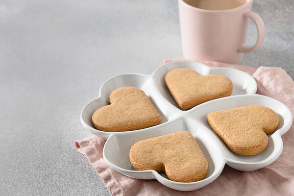 Heart shaped cookies on white combination plate for Valentines Day.