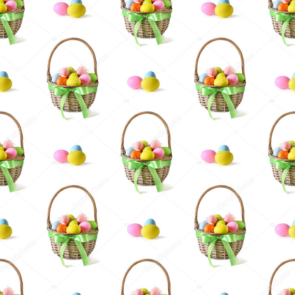 Easter wicker basket with pastel colorful eggs isolated on white.