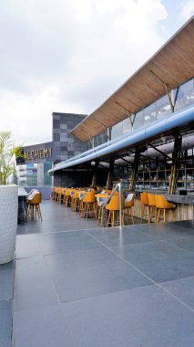 Bangalore,Karnataka,India-June 18 2022: Alchemy of Chancery Pavilion Hotel, the best rooftop bar with indoor and outdoor seating. Hidden gem at Residency road, Bengaluru where they serve delicious starters and dessert.