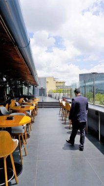 Bangalore,Karnataka,India-June 18 2022: Alchemy of Chancery Pavilion Hotel, the best rooftop bar with indoor and outdoor seating. Hidden gem at Residency road, Bengaluru where they serve delicious starters and dessert.