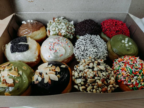 Assortment of donuts of different flavors in a box